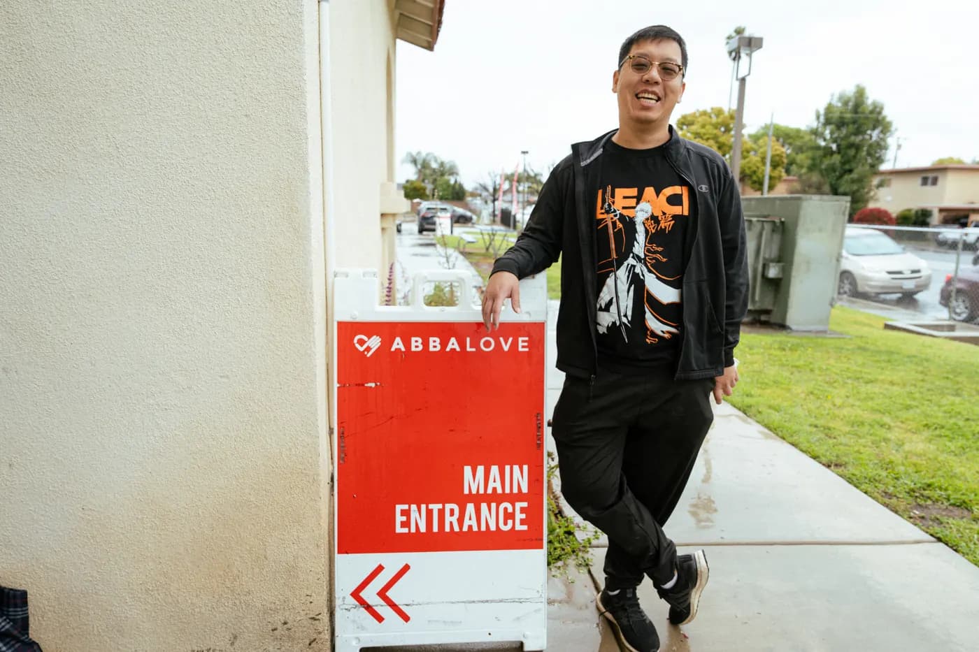 A greeter welcoming a guest at the door